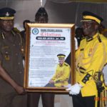 Director General of Prisons Mr. Isaac Kofi Egyir (left) presenting the citation to Nana Dr. Kofi Antwi II (right)