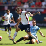 Chelsea star Christian Pulisic wearing an orange armband while playing US friendly against Uruguay. Photo by John Dorton/ISI Photos/Getty Images