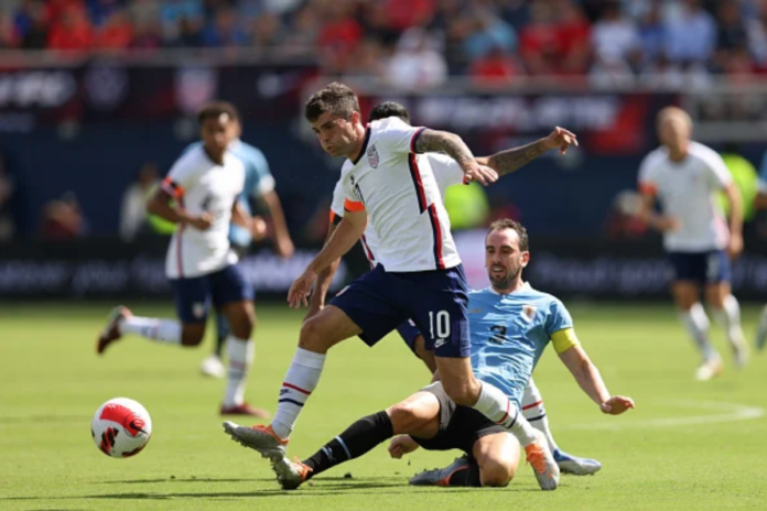 Chelsea star Christian Pulisic wearing an orange armband while playing US friendly against Uruguay. Photo by John Dorton/ISI Photos/Getty Images
