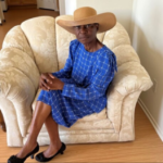 Vicky Umodu sits on the chair at her home in Colton, Calif., where she found $36,000 in cash stuffed inside the seat cushion. (Diseph Mgborogwu)