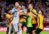 DOHA, QATAR - JUNE 13: Australia celebrate after defeating Peru in the 2022 FIFA World Cup Playoff match between Australia Socceroos and Peru at Ahmad Bin Ali Stadium on June 13, 2022 in Doha, Qatar. (Photo by Joe Allison/Getty Images) GETTY IMAGES