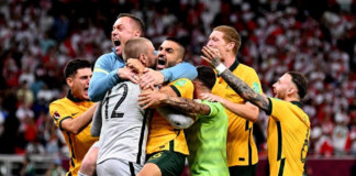 DOHA, QATAR - JUNE 13: Australia celebrate after defeating Peru in the 2022 FIFA World Cup Playoff match between Australia Socceroos and Peru at Ahmad Bin Ali Stadium on June 13, 2022 in Doha, Qatar. (Photo by Joe Allison/Getty Images) GETTY IMAGES