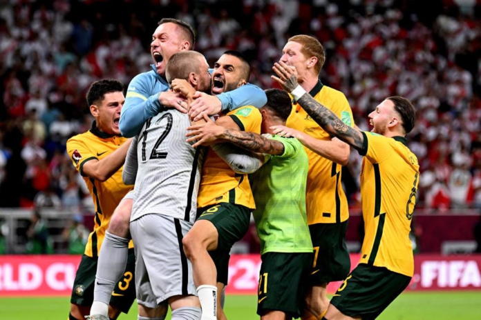 DOHA, QATAR - JUNE 13: Australia celebrate after defeating Peru in the 2022 FIFA World Cup Playoff match between Australia Socceroos and Peru at Ahmad Bin Ali Stadium on June 13, 2022 in Doha, Qatar. (Photo by Joe Allison/Getty Images) GETTY IMAGES