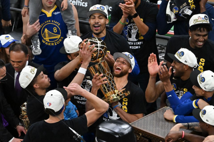Jun 16, 2022; Boston, Massachusetts, USA; Golden State Warriors guard Stephen Curry (30) holds up the Larry O'Brien Trophy after defeating the Boston Celtics in game six of the 2022 NBA Finals at TD Garden. Mandatory Credit: Bob DeChiara-USA TODAY Sports/ Image Credit: REUTERS