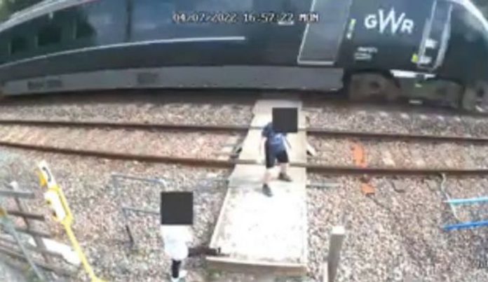 As the 125mph train approached, the two children were seen dancing and playing on the line source: mirroruk