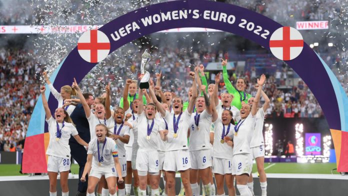 Leah Williamson of England lifts the UEFA Women's EURO 2022 Trophy after their sides victory during the UEFA Women's Euro 2022 final match between England and Germany at Wembley Stadium on July 31, 2022 in London, England. (Photo by Shaun Botterill/Getty) Image credit: Getty Images