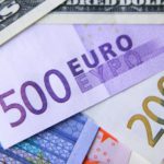 Euro falls below dollar for the first time