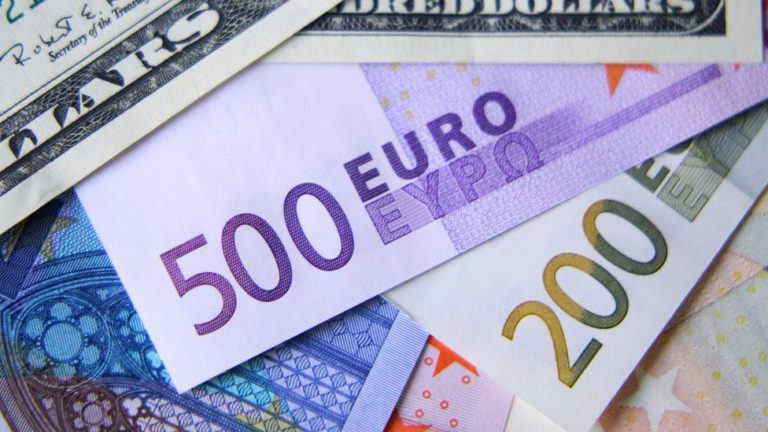 Euro falls below dollar for the first time