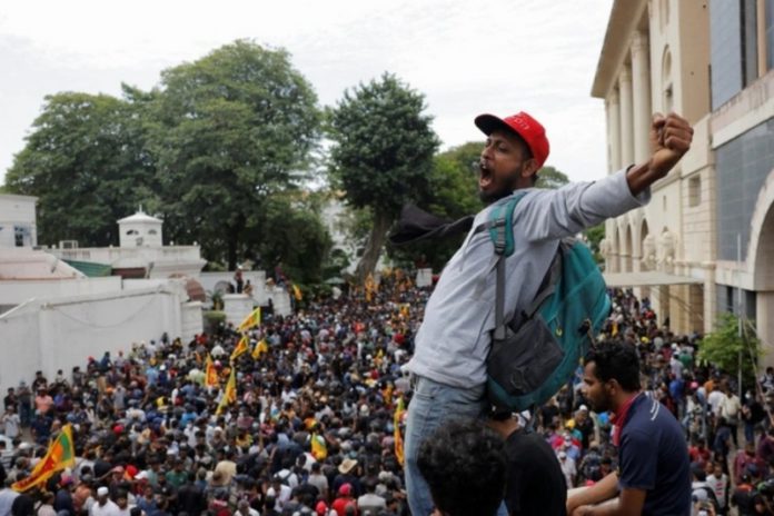 Sri Lankan protesters inside the President's House in Colombo [Dinuka Liyanawatte/Reuters]