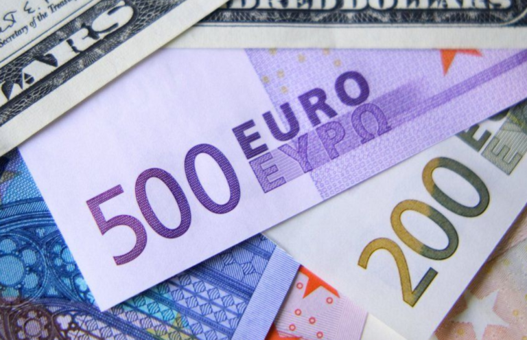 Euro falls below dollar for first time in 20 years