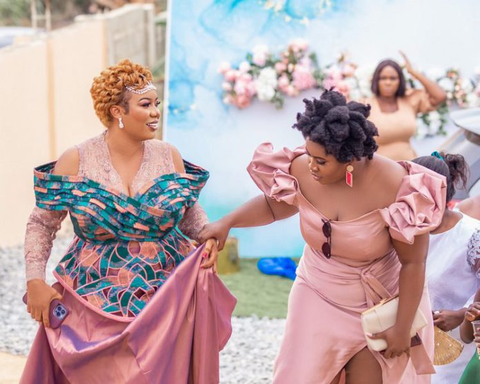 Bridget Otoo with Lydia Forson at former's wedding