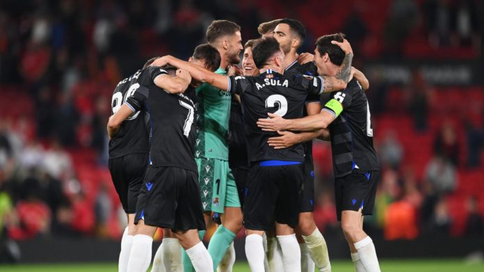 Real Sociedad players celebrate victory after the final whistle in the UEFA Europa League group E match between Manchester United and Real Sociedad at Old Trafford Image credit: Getty Images