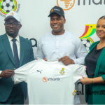 Kurt Okraku [L] and Mara officials [R]