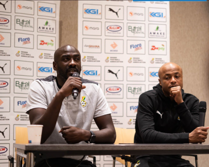 Otto Addo with Andre Ayew at a presser