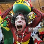 Supporters of Ghana's football squad cheer during the Group D, first round, 2010 World Cup football match Germany vs Ghana on June 23, 2010 at Soccer City stadium in Soweto, suburban Johannesburg. Germany won by 1-0. AFP PHOTO/Monirul Bhuiyan (Photo credit should read Monirul Bhuiyan/AFP via Getty Images)