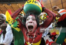 Supporters of Ghana's football squad cheer during the Group D, first round, 2010 World Cup football match Germany vs Ghana on June 23, 2010 at Soccer City stadium in Soweto, suburban Johannesburg. Germany won by 1-0. AFP PHOTO/Monirul Bhuiyan (Photo credit should read Monirul Bhuiyan/AFP via Getty Images)