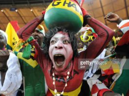 Supporters of Ghana's football squad cheer during the Group D, first round, 2010 World Cup football match Germany vs Ghana on June 23, 2010 at Soccer City stadium in Soweto, suburban Johannesburg. Germany won by 1-0. AFP PHOTO/Monirul Bhuiyan (Photo credit should read Monirul Bhuiyan/AFP via Getty Images)