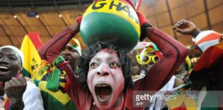 Supporters of Ghana's football squad cheer during the Group D, first round, 2010 World Cup football match Germany vs Ghana on June 23, 2010 at Soccer City stadium in Soweto, suburban Johannesburg. Germany won by 1-0. AFP PHOTO/Monirul Bhuiyan (Photo credit should read Monirul Bhuiyan/AFP via Getty Images)