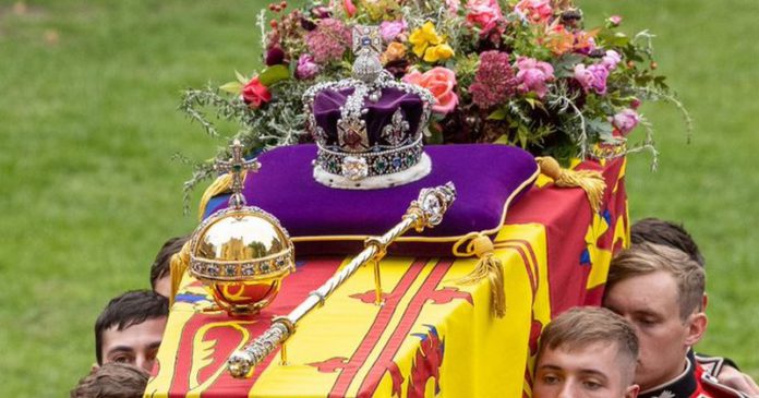 The coffin of Queen Elizabeth II being carried to St George's Chapel carrying the orb, sceptre and the crown all fixed in place (Image: Andy Commins / Daily Mirror)