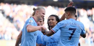 Erling Haaland celebrates with Joao Cancelo and Nathan Ake of Manchester City after scoring their team's fourth goal during the Premier League match between Manchester City and Southampton FC at Etihad Stadium on October 08, 2022 in Manchester, England. Image credit: Getty Images