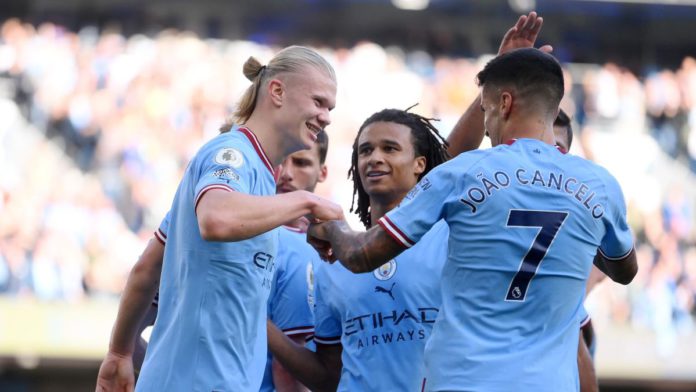 Erling Haaland celebrates with Joao Cancelo and Nathan Ake of Manchester City after scoring their team's fourth goal during the Premier League match between Manchester City and Southampton FC at Etihad Stadium on October 08, 2022 in Manchester, England. Image credit: Getty Images