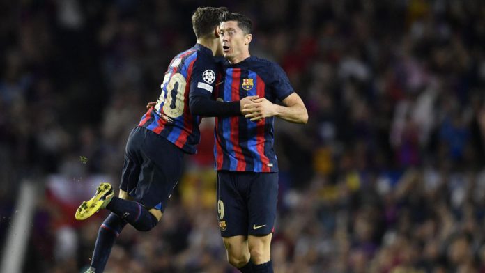 Barcelona's Polish forward Robert Lewandowski (R) celebrates scoring his team's second goal during the UEFA Champions League 1st round, group C, football match between FC Barcelona and Inter Milan at the Camp Nou stadium in Barcelona on October 12, 2022. Image credit: Getty Images