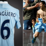 Aguero tore off the shirt, which is stained with both mud and champagne, in celebration