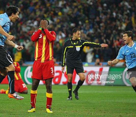 JOHANNESBURG, SOUTH AFRICA - JULY 02: Asamoah Gyan of Ghana reacts as he misses a late penalty kick in extra time to win the match during the 2010 FIFA World Cup South Africa Quarter Final match between Uruguay and Ghana at the Soccer City stadium on July 2, 2010 in Johannesburg, South Africa. (Photo by Cameron Spencer/Getty Images)