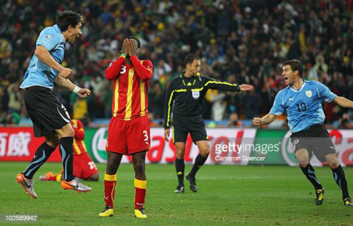 JOHANNESBURG, SOUTH AFRICA - JULY 02: Asamoah Gyan of Ghana reacts as he misses a late penalty kick in extra time to win the match during the 2010 FIFA World Cup South Africa Quarter Final match between Uruguay and Ghana at the Soccer City stadium on July 2, 2010 in Johannesburg, South Africa. (Photo by Cameron Spencer/Getty Images)