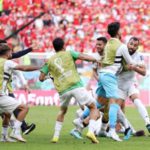Iran celebrate Rouzbeh Cheshmi's goal