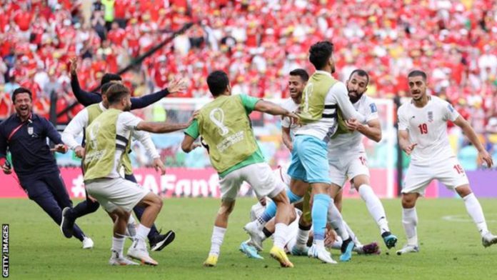 Iran celebrate Rouzbeh Cheshmi's goal