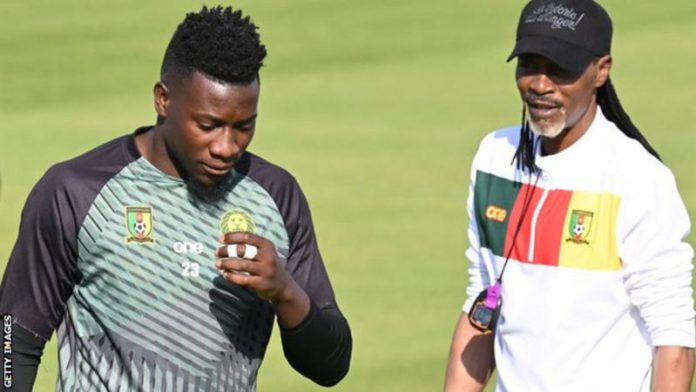 Andre Onana (left) and coach Rigobert Song, pictured during training on Sunday, have fallen out in an apparent row over tactics