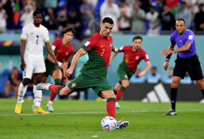 FIFA World Cup Qatar 2022 - Group H - Portugal v Ghana - Stadium 974, Doha, Qatar - November 24, 2022 Portugal's Cristiano Ronaldo scores their first goal from the penalty spot REUTERS/Jennifer Lorenzini