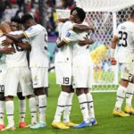 Ghana's midfielder #10 Andre Ayew (L) celebrates with teammates after scoring his team's first goal during the Qatar 2022 World Cup Group H football match between Portugal and Ghana at Stadium 974 in Doha on November 24, 2022. (Photo by MANAN VATSYAYANA / AFP) (Photo by MANAN VATSYAYANA/AFP via Getty Images) FIFA World Cup