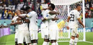 Ghana's midfielder #10 Andre Ayew (L) celebrates with teammates after scoring his team's first goal during the Qatar 2022 World Cup Group H football match between Portugal and Ghana at Stadium 974 in Doha on November 24, 2022. (Photo by MANAN VATSYAYANA / AFP) (Photo by MANAN VATSYAYANA/AFP via Getty Images) FIFA World Cup