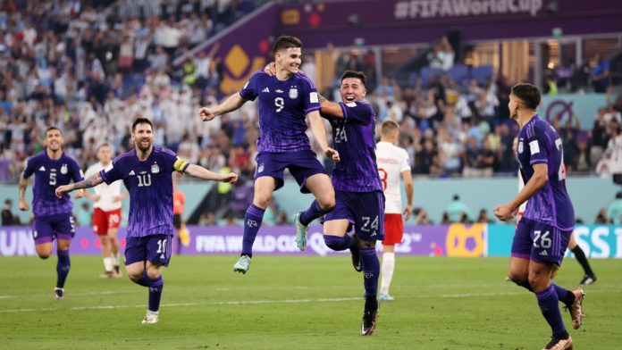 Julian Alvarez of Argentina celebrates with teammates after scoring their team’s second goal during the FIFA World Cup Qatar 2022 Group C match between Poland and Argentina at Stadium 974 on November 30, 2022 in Doha, Qatar. (Photo by Clive Brunskill) Image credit: Getty Images