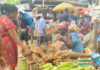 Makola market, Accra: Woman buying yams on a partly cloudy day | photo taken by Adomonline's Dennis K. Adu