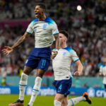 2022 World Cup: Rashford double sees England top group as Wales exit