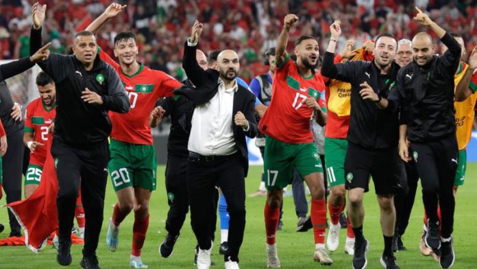 Walid Regragui leads the celebrations after Morocco became the first African team to reach a World Cup semi-final