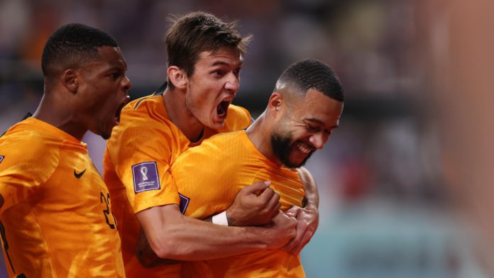 Memphis Depay of Netherlands celebrates with teammates after scoring the team's first goal during the FIFA World Cup Qatar 2022 Round of 16 match between Netherlands and USA at Khalifa International Stadium on December 03, 2022 in Doha, Qatar Image credit: Getty Images
