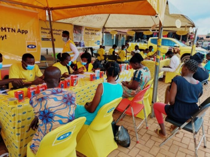 [File photo] Customers registering their SIM cards at Temporary Registration point at Madina market in Accra