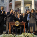 President Joe Biden signs the Respect for Marriage Act on the South Lawn of the White House.