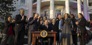 President Joe Biden signs the Respect for Marriage Act on the South Lawn of the White House.