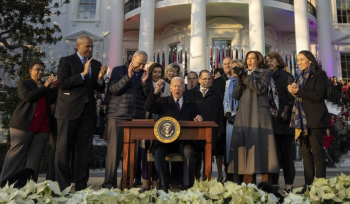 President Joe Biden signs the Respect for Marriage Act on the South Lawn of the White House.