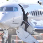 Musk is seen deplaning from his private jet in Los Angeles this past February. Diggzy/Jesal/Shutterstock