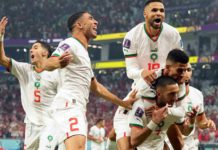 Morocco's Hakim Ziyech is mobbed after scoring the opening goal