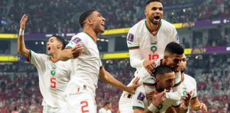 Morocco's Hakim Ziyech is mobbed after scoring the opening goal