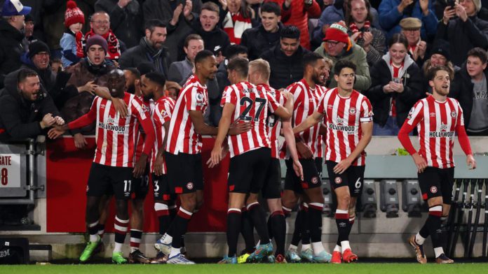 Yoane Wissa of Brentford celebrates with teammates after scoring the team's second goal during the Premier League match between Brentford FC and Liverpool FC at Brentford Community Stadium on January 02, 2023 in Brentford, England Image credit: Getty Images