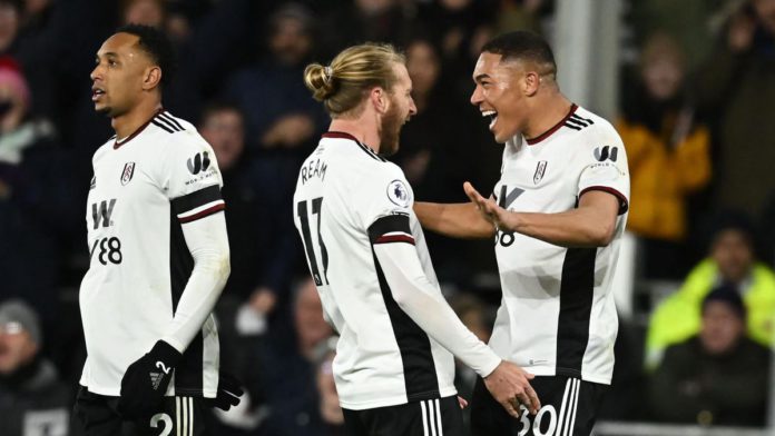 Fulham's Brazilian striker Carlos Vinicius (R) celebrates with Fulham's US defender Tim Ream (C) after scoring their second goal during the English Premier League football match between Fulham and Chelsea at Craven Cottage in London on January 12, 2023 Image credit: Getty Images