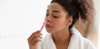 Lady shaving her face